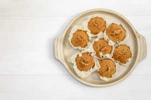 overhead shot of seven muffins on a circular ceramic tray