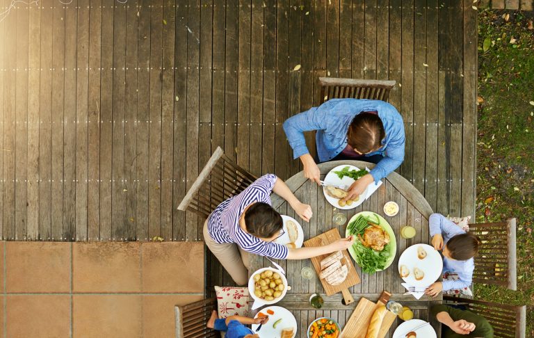 High angle shot of a family enjoying lunch together outside