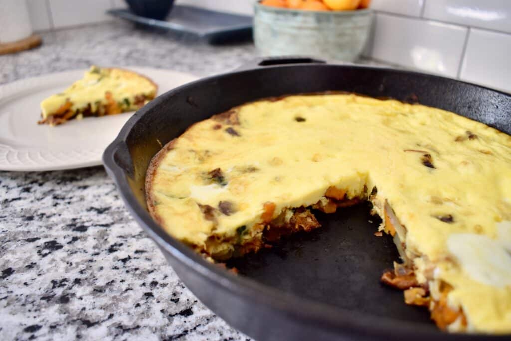 Meat and veggie frittata in cast iron pan