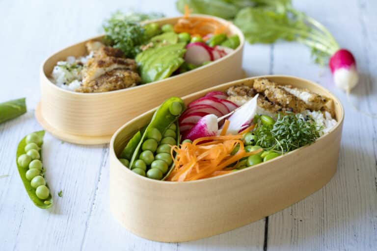 Japanese style bento lunch box with chicken, rice and vegetables