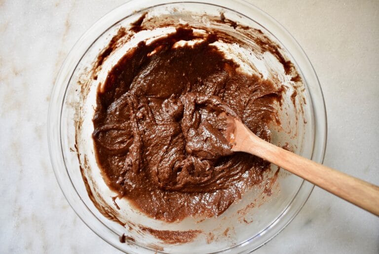 overhead shot of brownie batter fully mixed in glass bowl