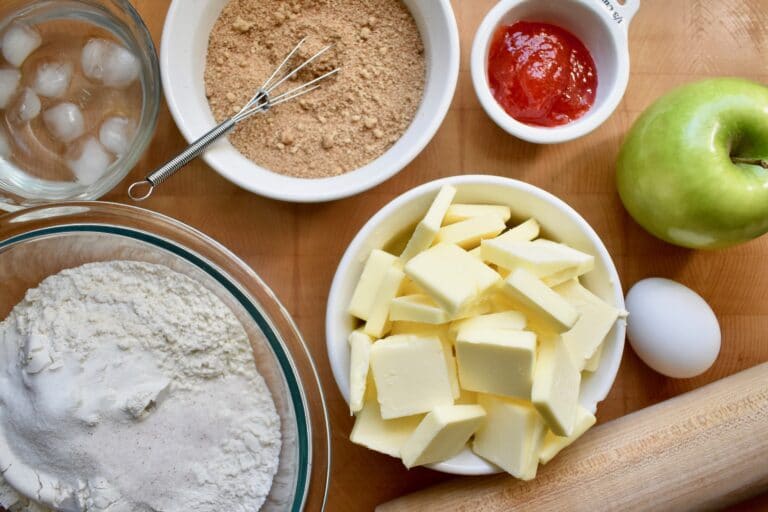 overhead shot of ingredients for homemade hand pies portioned into white bowls