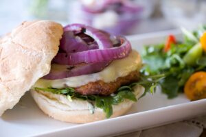 close up of a chorizo burger on bun