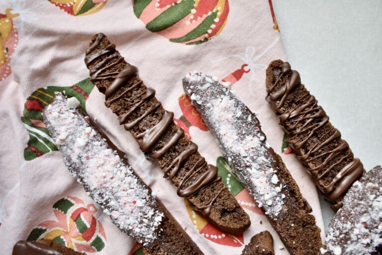 overhead shot of chocolate peppermint biscotti on a festive napkin