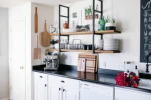bright kitchen with espresso machine and cutting boards on the counter