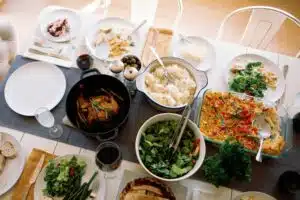 overhead shot of a table filled with food for a dinner feast