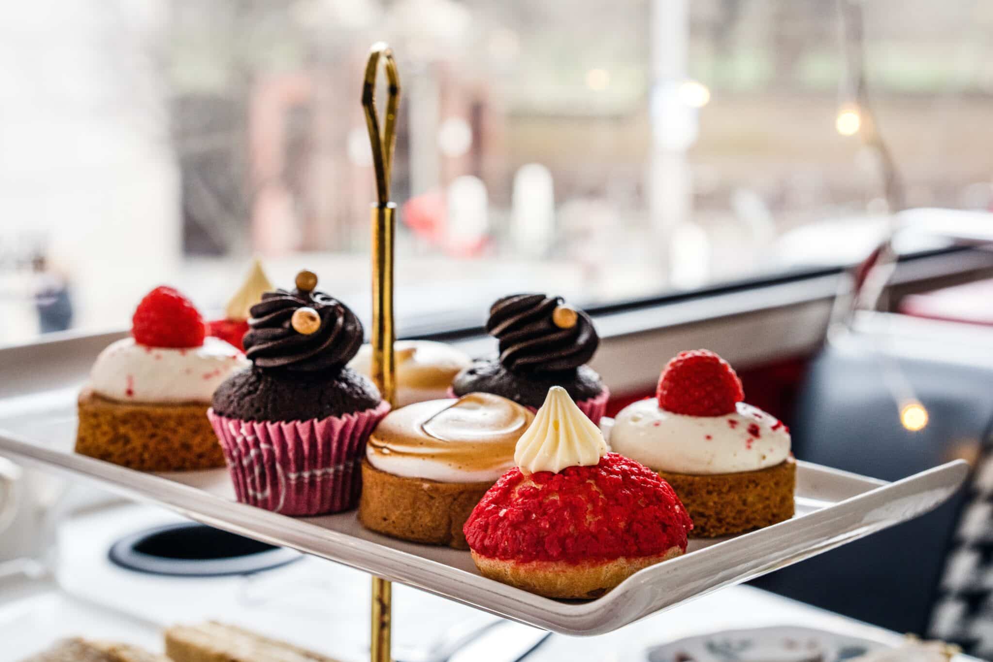 red and brown delicate pastries on a golden serving tray