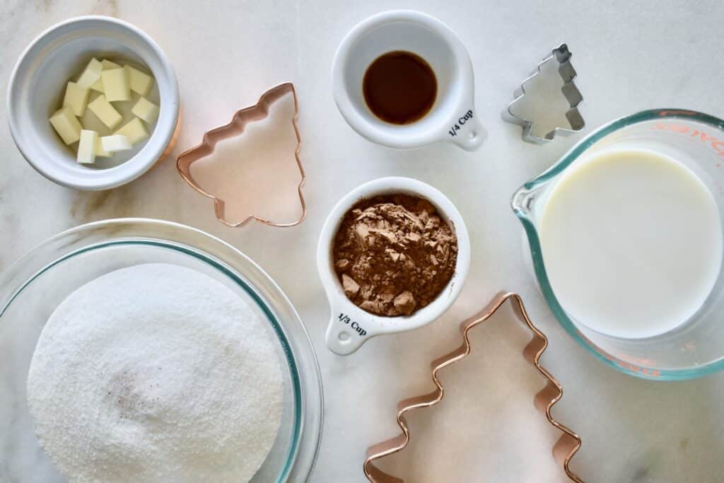 overhead shot of ingredients for fudge and christmas cookie cutters