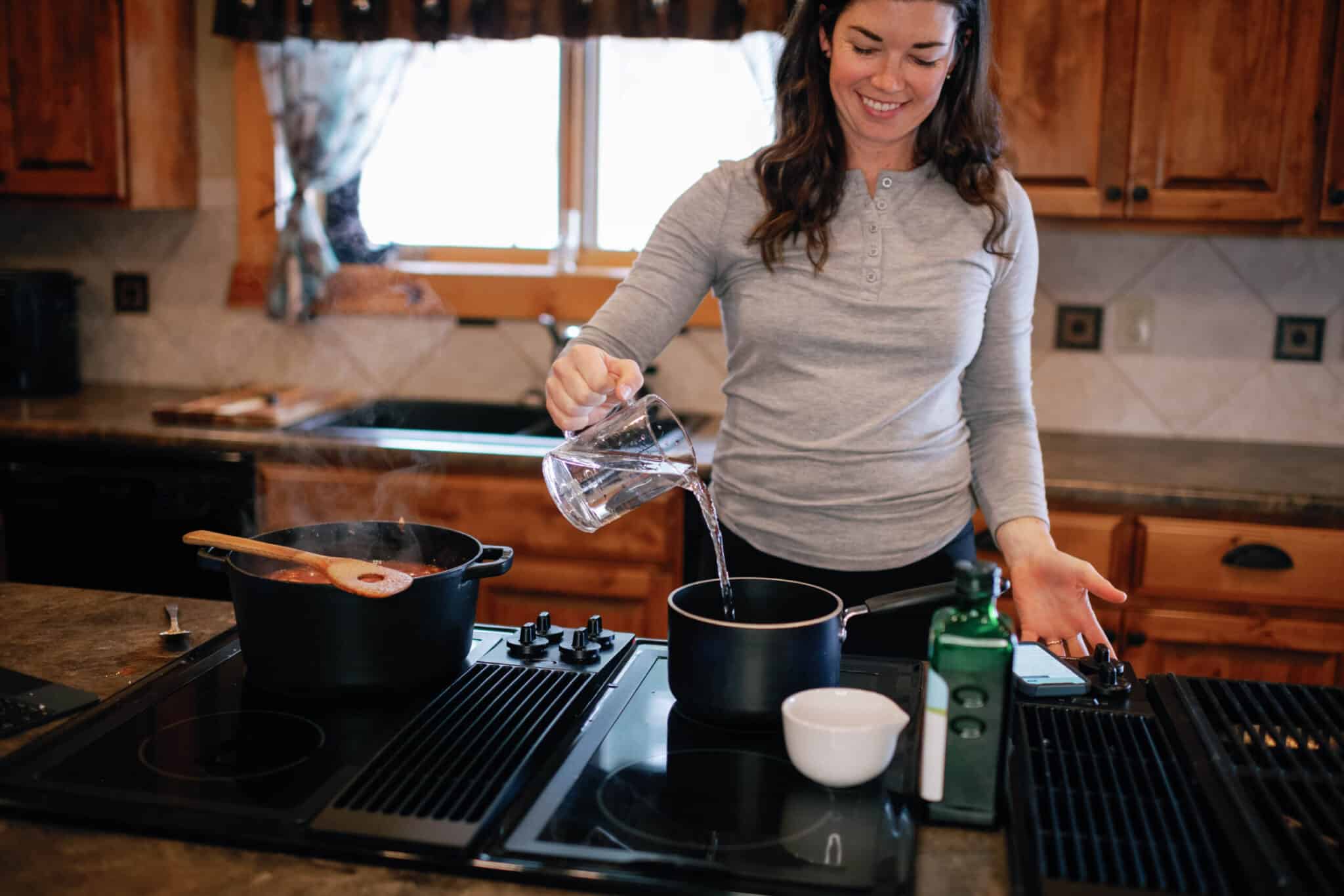 image of woman pouring water into a pot